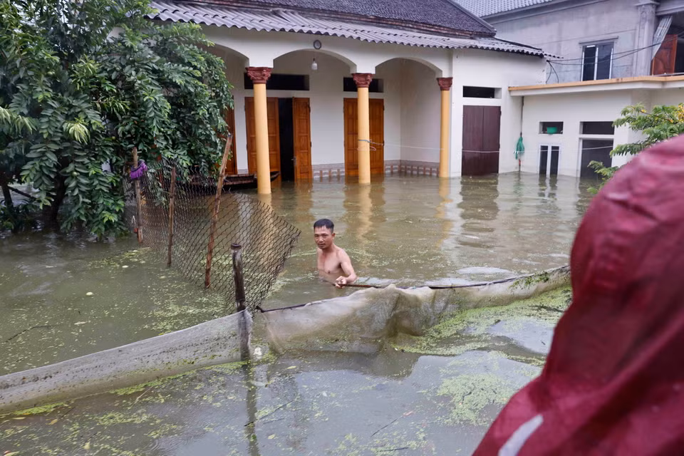 Quang cảnh ngập lụt tại Thôn Nhân Lý, xã Nam Phương Tiến, huyện Chương Mỹ. (Ảnh: Doãn Tấn/TTXVN)