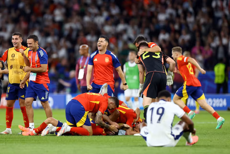Niềm vui của các cầu thủ Tây Ban Nha. (Nguồn: Getty Images)