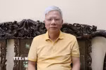 Ông Phạm Văn Dẫn, Bí thư chi bộ phố Tân Văn, phường Hoa Lư, tỉnh Ninh Bình, đánh giá việc thực hiện Nghị quyết Đại hội đại biểu toàn quốc lần thứ XIII của Đảng trong dự thảo văn kiện. (Ảnh: Thùy Dung/TTXVN)