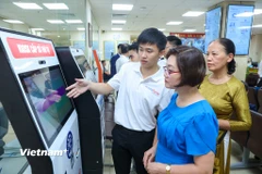 Trung tâm Phục vụ hành chính công Hà Nội đảm bảo hiệu quả phục vụ người dân và doanh nghiệp. (Ảnh: Minh Sơn/Vietnam+)