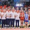 Đội tuyển bóng chuyền nữ Việt Nam giành HCB tại SEA Games 33. (Ảnh: Minh Quyết/TTXVN)