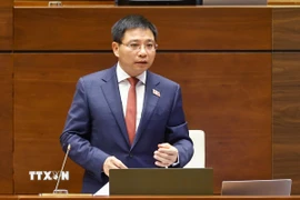 Bộ trưởng Bộ Tài chính Nguyễn Văn Thắng giải trình, làm rõ một số vấn đề đại biểu Quốc hội nêu. (Ảnh: Doãn Tấn/ TTXVN)