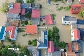 Nước nhấn chìm nhiều ngôi nhà tại các tổ dân phố Yên Viên, Vân Hà, Thổ Hà, phường Vân Hà, tỉnh Bắc Ninh. (Ảnh: Phan Phương/TTXVN)
