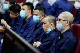 Các bị cáo tại phiên tòa phúc thẩm. (Ảnh: Thành Chung/TTXVN)