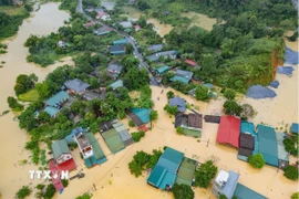 Ngập lụt trên diện rộng ở các phường Hà Giang 1, 2 (Tuyên Quang). (Ảnh: TTXVN phát)