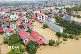 Nhiều khu vực của Bắc Ninh bị nước lũ bủa vây. (Ảnh: Thanh Thương/TTXVN)