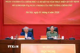 Phó Thủ tướng Thường trực Nguyễn Hòa Bình và Thượng tướng Lê Văn Tuyến, Thứ trưởng Bộ Công an chủ trì hội nghị. (Ảnh: Phạm Kiên/TTXVN)