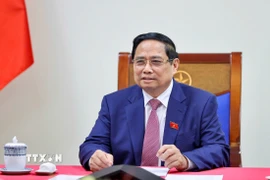 Thủ tướng Phạm Minh Chính điện đàm với Tổng giám đốc Tập đoàn Năng lượng Nguyên tử Quốc gia Liên bang Nga (Rosatom) Alexey Likhachev. (Ảnh: Dương Giang/TTXVN)