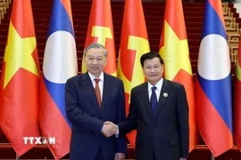 Tổng Bí thư Tô Lâm và Tổng Bí thư, Chủ tịch nước Lào Thongloun Sisoulith đồng chủ trì Cuộc gặp cấp cao giữa Đảng Cộng sản Việt Nam và Đảng Nhân dân Cách mạng Lào. (Ảnh: Thống Nhất/TTXVN)
