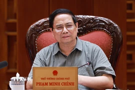 Thủ tướng Phạm Minh Chính chủ trì cuộc họp về triển khai chiến dịch xây dựng trường học cho các xã biên giới. (Ảnh: Dương Giang/TTXVN)