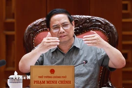 Thủ tướng Phạm Minh Chính chủ trì cuộc họp về triển khai chiến dịch xây dựng trường học cho các xã biên giới. Ảnh: Dương Giang-TTXVN