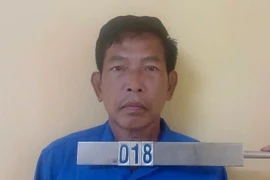 Đối tượng Vũ Văn Huân tại cơ quan công an. (Ảnh: TTXVN phát)