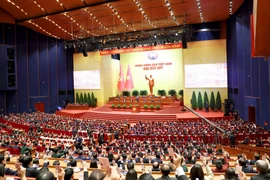 Đại hội biểu quyết thông qua danh sách bầu cử Ban chấp hành Trung ương Đảng khóa XIV. (Nguồn: TTXVN)