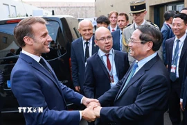 Thủ tướng Phạm Minh Chính hội kiến Tổng thống Pháp Emmanuel Macron. (Ảnh: Dương Giang/TTXVN)