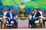 Thủ tướng Phạm Minh Chính hội kiến Tổng Bí thư, Chủ tịch nước Lào Thongloun Sisoulith. (Ảnh: Dương Giang/TTXVN)