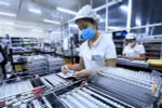Công nhân làm việc tại một công ty có vốn FDI. (Ảnh: Tuấn Anh/TTXVN)
