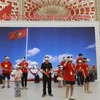 Khách tham quan trải nghiệm khu trưng bày của Đài Tiếng nói Việt Nam tại Triển lãm Thành tựu đất nước. (Ảnh: PV/Vietnam+)