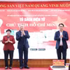 Phó Thủ tướng Thường trực Chính phủ Nguyễn Hòa Bình cùng các đại biểu thực hiện nghi thức ra mắt "Tủ sách điện tử Chủ tịch Hồ Chí Minh" tại Nhà xuất bản Chính trị quốc gia Sự thật. (Ảnh: PV/Vietnam+)