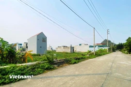 Việc đánh thuế phần chênh lệch lãi giữa các lần giao dịch bất động sản sẽ hạn chế tình trạng đầu cơ, thổi giá trên thị trường. (Ảnh: Việt Hùng/Vietnam+)