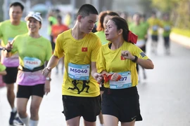 Giải chạy “Run for Love” của Vietnam Airlines năm nay tiếp tục có sự góp mặt của các vận động viên khiếm thị. (Ảnh: PV/Vietnam+)
