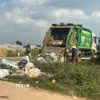 Công ty vệ sinh môi trường Gia Phúc JPC cam kết thực hiện đúng lịch thu gom, nếu có thay đổi sẽ có báo cáo Ủy ban Nhân dân xã ít nhất 2 ngày. (Ảnh: Khiếu Tư/TTXVN)