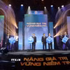 Nghi thức khai trương hệ thống công nghệ thông tin mới của thị trường chứng khoán Việt Nam. (Ảnh: Hứa Chung/TTXVN)