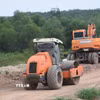 Máy lu và máy đào được huy động thi công, lu lèn nền đường cao tốc Thành phố Hồ Chí Minh-Thủ Dầu Một-Chơn Thành. (Ảnh: Đậu Tất Thành/TTXVN)