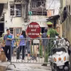 Lực lượng chức năng phong tỏa hiện trường vụ cháy tại ngõ 2B Văn Cao, phường Tây Hồ, thành phố Hà Nội để phục vụ công tác điều tra. (Ảnh: Trung Nguyên/TTXVN)