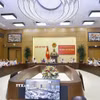 Đại biểu biểu quyết thông qua chương trình hội nghị. (Ảnh: Doãn Tấn/TTXVN)