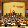 Bộ trưởng Bộ Công an Lương Tam Quang giải trình, làm rõ một số vấn đề đại biểu Quốc hội nêu. (Ảnh: Doãn Tấn/TTXVN)