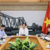 Phó Thủ tướng Hồ Quốc Dũng chủ trì cuộc họp giải quyết vướng mắc liên quan đến thu hồi đất của Tổng Công ty Giấy Việt Nam trên địa bàn tỉnh Phú Thọ. (Ảnh: TTXVN phát)