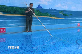 Thương binh, Phạm Quang Dương, phường Điện Biên Phủ (tỉnh Điện Biên) phát triển kinh tế với mô hình xây dựng bể bơi và cơ sở giáo dục mầm non tư thục mỗi năm cho thu nhập từ 900 triệu đến 1 tỷ đồng. (Ảnh: Phan Quân/TTXVN)