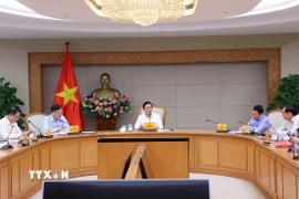 Phó Thủ tướng Trần Hồng Hà chủ trì cuộc làm việc. (Ảnh: Văn Điệp/TTXVN)