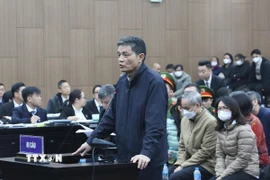 Cựu Cục trưởng Cục An toàn thực phẩm (Bộ Y tế) Nguyễn Thanh Phong tại phiên tòa. (Ảnh: Kim Anh/TTXVN)