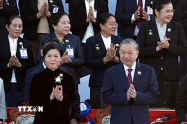 Tổng Bí thư Tô Lâm và Phu nhân dự Lễ kỷ niệm 50 năm Quốc khánh Lào và 105 năm Ngày sinh Chủ tịch Kaysone Phomvihane. (Ảnh: Thống Nhất\/TTXVN)