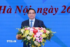 Thủ tướng Phạm Minh Chính phát biểu tại Hội nghị tổng kết Chương trình và Phong trào thi đua “Cả nước chung tay xóa nhà tạm, nhà dột nát”. (Ảnh: Dương Giang/TTXVN)
