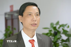 Ông Lê Văn Thụy, Phó Chủ tịch Tổng hội người Việt Nam tại Lào, trả lời phỏng vấn phóng viên TTXVN. (Ảnh: Xuân Tú/TTXVN)