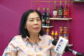 Bà Phạm Thị Hoa - Phó Tổng Giám đốc công ty Fusion Foods tại Nga, trả lời phỏng vấn TTXVN. (Ảnh: Trần Hải/TTXVN)