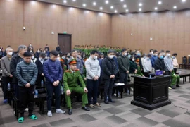 Các bị cáo tại phiên tòa xét xử. (Ảnh: Phạm Kiên/TTXVN)