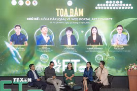 Đại biểu chia sẻ thông tin về thực phẩm, nông sản minh bạch tại lễ ra mắt AFT Connect. (Ảnh: Xuân Anh/TTXVN)