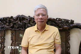 Ông Phạm Văn Dẫn, Bí thư chi bộ phố Tân Văn, phường Hoa Lư, tỉnh Ninh Bình, đánh giá việc thực hiện Nghị quyết Đại hội đại biểu toàn quốc lần thứ XIII của Đảng trong dự thảo văn kiện. (Ảnh: Thùy Dung/TTXVN)