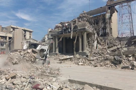 Những tòa nhà bị phá hủy sau các cuộc tập kích tại Tehran, Iran ngày 4/3/2026. (Ảnh: THX/TTXVN)