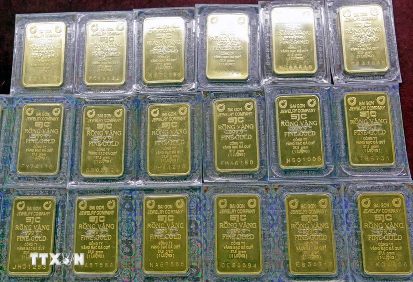 Giá vàng SJC của Công ty Vàng bạc đá quý Sài Gòn và Công ty Doji niêm yết từ 156,6-158,6 triệu đồng/lượng (mua vào/bán ra). (Ảnh: TTXVN)