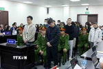 Các bị cáo tại phiên tòa xét xử. (Ảnh: Phạm Kiên/TTXVN)
