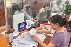Ủy ban nhân dân xã có thể sắp xếp, bố trí người hoạt động không chuyên trách cấp xã vào thôn, tổ dân phố. (Ảnh: PV/Vietnam+)