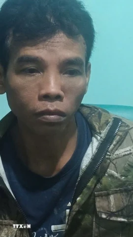 Đối tượng Điểu Trung bị bắt. (Ảnh: TTXVN phát)