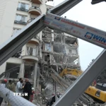 Tòa nhà bị phá hủy sau cuộc không kích tại Tehran, Iran, ngày 23/3/2026. (Ảnh: THX/TTXVN)