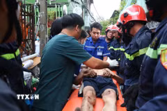 Nạn nhân được cứu nạn kịp thời. (Ảnh: TTXVN phát)