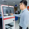 Agribank hợp tác cùng địa phương triển khai Kiosk thông minh và hệ thống số hóa, thúc đẩy phát triển kinh tế xã hội bền vững. (Ảnh: Vietnam+)