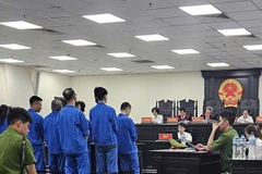 Phiên tòa xét xử 9 bị cáo trong vụ bắt giữ người, đòi nợ hộ. (Nguồn: Báo Lao động)